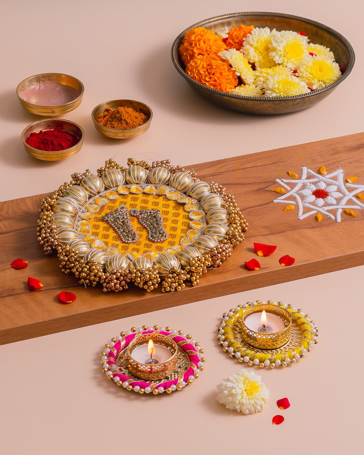 Festive home decor product photography of decorated Lakshmi feet thali with diyas by NiRam Creatives Bangalore